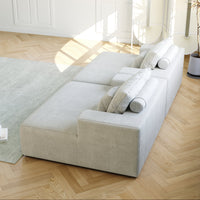 White/cream modular sofa with two back cushions and small throw pillows, front view