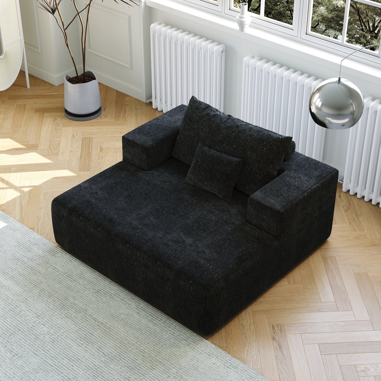 Dark teal modular sofa with cushions and armrests, from a top-down angle